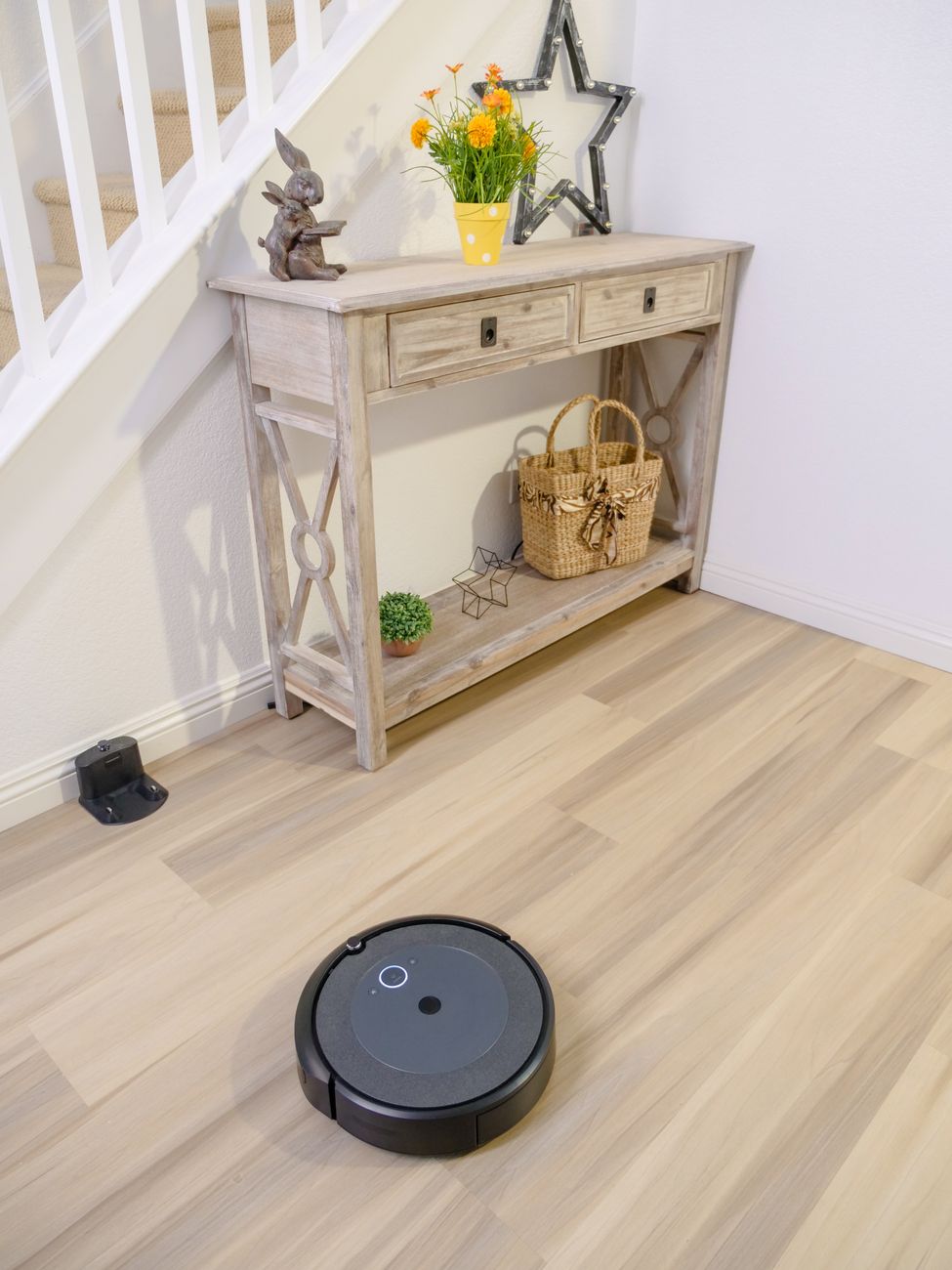 Sleek futuristic robotic vacuum automated maintenance dock cleans elegant modern living room